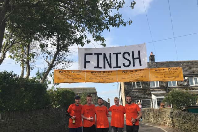 The fundraising runners at the finish line in Upper Cumberworth, Huddersfield, on Sunday. Pictured, from left: Jack Firth, Sam Beresford, Joe Metcalfe, Rob Mynett, Joe Butcher