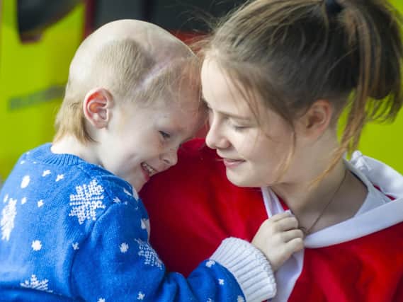 Three-year-old Ellis Price pictured with his sister Caitlin during early Christmas celebrations for him on September 8.

Picture Tony Johnson
