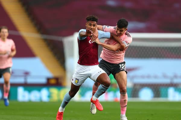 BLADES BLOW: The tussle between Sheffield United captain John Egan, right, and Aston Villa striker Ollie Watkins which saw Egan sent off. Photo by Clive Rose/Getty Images.