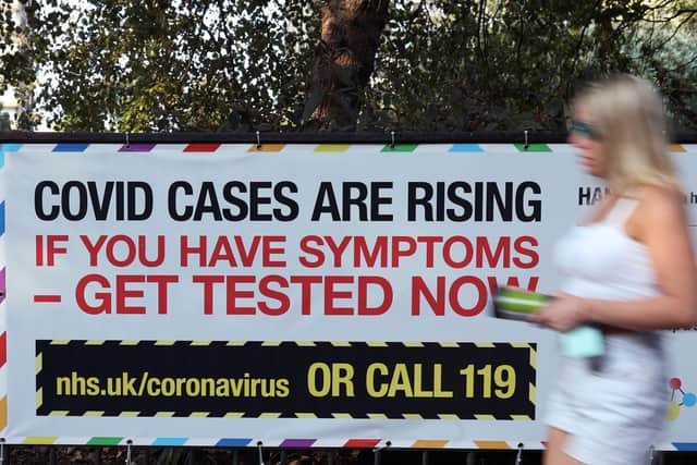A public information sign warning of rising Covid-19 cases in London after Prime Minister Boris Johnson announced a range of new restrictions to combat the the coronavirus outbreak in England. Photo: PA