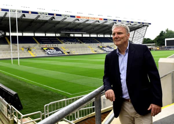 Locked out: Gary Hetherington pictured in front of Emerald Headingley's new South Stand which will remain devoid of fans for the foreseeable future.