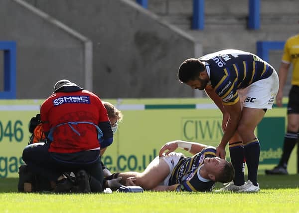 Leeds Rhinos' Harry Newman reacts after being injured during the Betfred Super League matchwith Hull KR at the Halliwell Jones Stadium, Warrington. Picture: Martin Rickett/PA Wire.