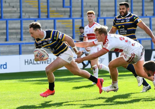 Leeds Rhinos forward James Donaldson scores the game's third try against his former club. Picture: Jonathan Gawthorpe/JPIMedia.