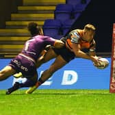 Great start: Greg Eden scores in the corner to put Castleford 10-0 up against Huddersfield. Picture: Jonathan Gawthorpe
