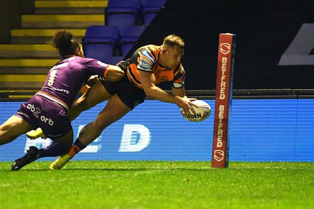 Great start: Greg Eden scores in the corner to put Castleford 10-0 up against Huddersfield. Picture: Jonathan Gawthorpe