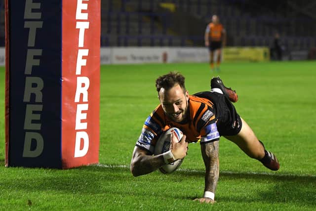 Up and running:
Castleford's Gareth O'Brien is all smiles as he scores the opening try of the match. Picture: Jonathan Gawthorpe