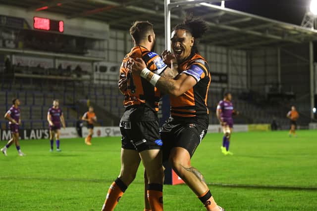 All smiles: Castleford's Gareth O'Brien celebrates scoring the opening try of the match with Jesse Sene-Lafao. 

Picture: Jonathan Gawthorpe