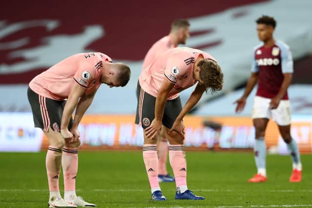 HARD TO TAKE: Sheffield United duo John Lundstram and Sander Berge after their efforts came to nothing in Monday evening's 1-0 loss at Aston Villa. Photo by Tim Goode - Pool/Getty Images.