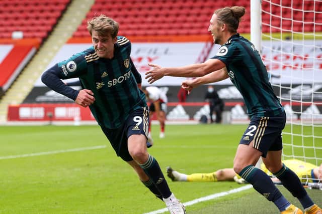 THREE IN THREE: Leeds United striker Patrick Bamford wheels away to celebrate with Luke Ayling as Sheffield United 'keeper Aaron Ramsdale, background, is finally beaten at Bramall Lane. Photo by Alex Livesey/Getty Images.