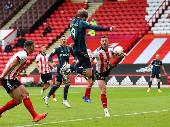 HISTORY IN THE MAKING: Leeds United's Jack Harrison and Rodrigo look on as Patrick Bamford heads home an 88th-minute winner in Sunday's Premier League Yorkshire derby at Sheffield United. Photo by Alex Livesey/Getty Images.