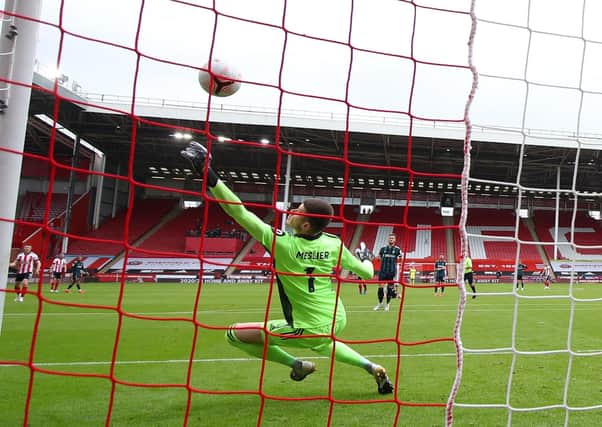 Top Stopper: Leeds United goalkeeper Illan Meslier made several outstanding saves, including this one from Sheffield United’s George Baldock and was unanimously voted man of the match by the YEP’s Leeds United jury. Picture: Simon Bellis/Sportimage