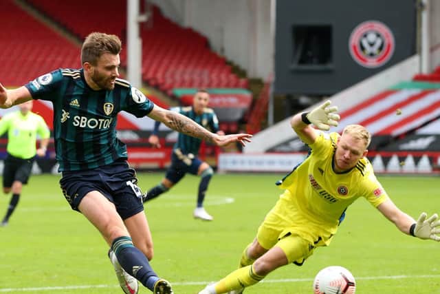 'EVERYWHERE': Leeds United's Stuart Dallas is closed down by Sheffield United goalkeeper Aaron Ramsdale in Sunday's Premier League Yorkshire derby at Bramall Lane. Photo by Alex Livesey/Getty Images.