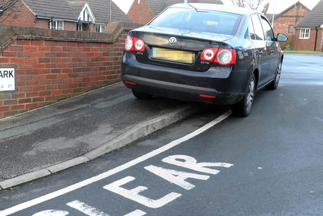 A motorist badly parked outside Churwell Primary School (photo taken 2014).