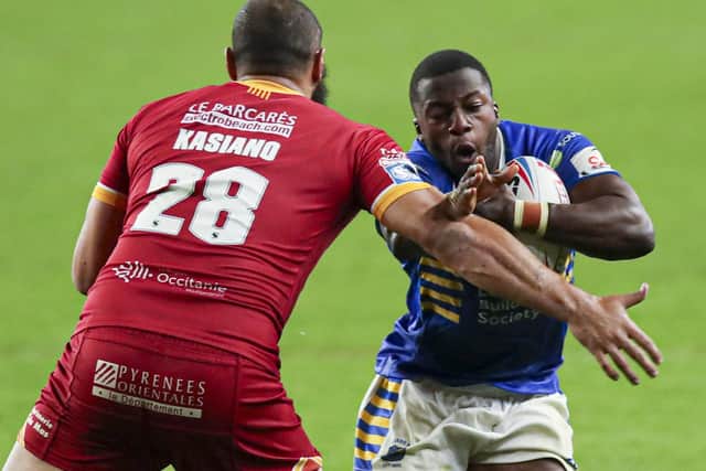 Leeds Rhinos' Muizz Mustapha, left, takes on Catalans Dragons' Sam Kasiano. Picture: Paul Currie/SWpix.com.