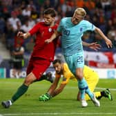 BIG MONEY PURCHASE: Portugal international centre-back Ruben Dias, left, pictured challenging the Netherlands' Donny van de Beek, has joined Manchester City for around £65m. Photo by Dean Mouhtaropoulos/Getty Images.