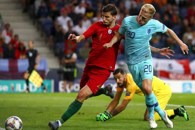 BIG MONEY PURCHASE: Portugal international centre-back Ruben Dias, left, pictured challenging the Netherlands' Donny van de Beek, has joined Manchester City for around £65m. Photo by Dean Mouhtaropoulos/Getty Images.