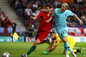 BIG MONEY PURCHASE: Portugal international centre-back Ruben Dias, left, pictured challenging the Netherlands' Donny van de Beek, has joined Manchester City for around £65m. Photo by Dean Mouhtaropoulos/Getty Images.
