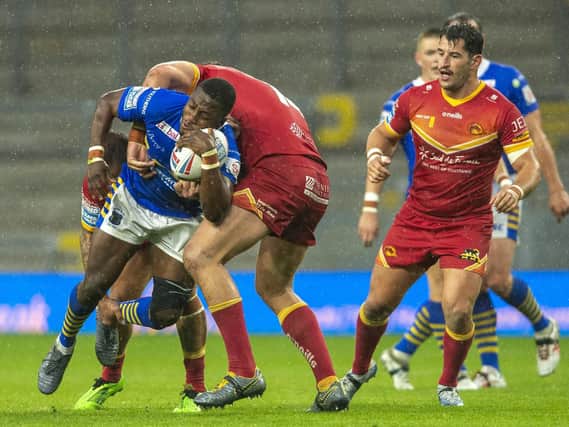 Muizz Mustapha is tackled by Julian Bousquet. Picture by Bruce Rollinson.