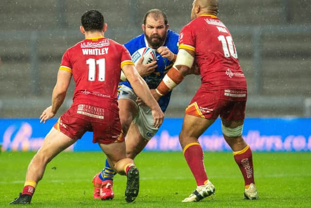 Adam Cuthbertson looks for a way past Catalans Dragons' Matthew Whiteley and Sam Moa.
 Picture: Bruce Rollinson.