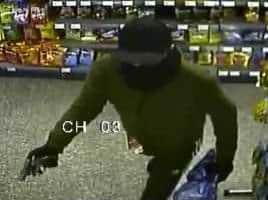 CCTV still of gunman during terrifying robbery at Wellstone Rise Post Office