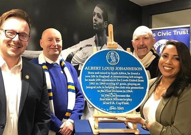 A blue plaque pays tribute to Albert Johanneson sits at the entrance to the East Stand at Elland Road.