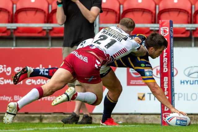 Tom Briscoe touches down to score against tomorrow's opponents Wigan back in August. Picture: Bruce Rollinson.