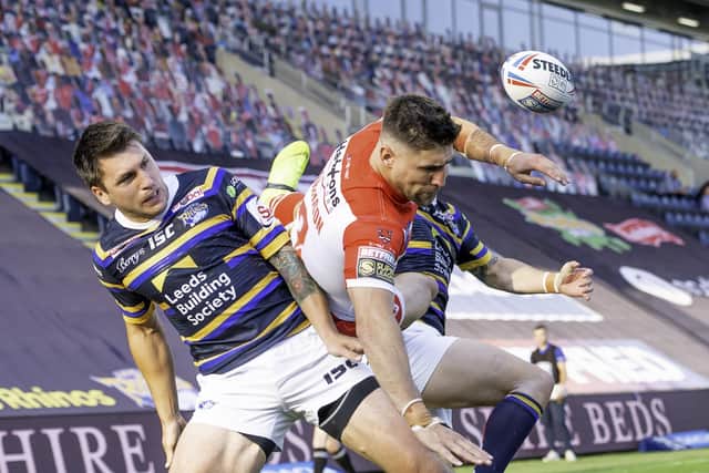 Tom Briscoe and St Helens' Tommy Makinson go for the aerial ball. Picture: Allan McKenzie/SWpix.com.