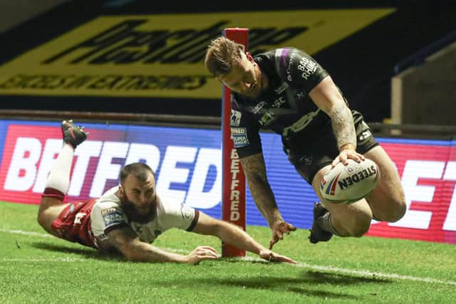 Looking good: Tom Johnstone of Wakefield Trinity scores a try in the defeat by Wigan. Picture by Paul Currie/SWpix.com