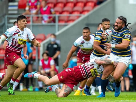 Konrad Hurrell is tackled by Zak Hardaker during Leeds' loss to Wigan in August. Picture by Bruce Rollinson.