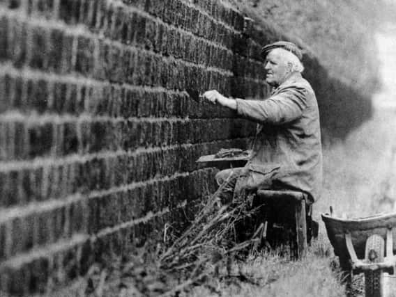 Colin Hartely repointing the wall which runs around the Harewood estate.