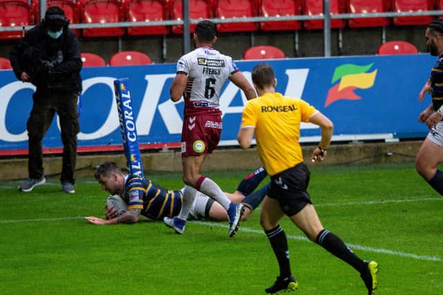 Tom Briscoe slides in for the Rhinos third try. Picture: Bruce Rollinson.