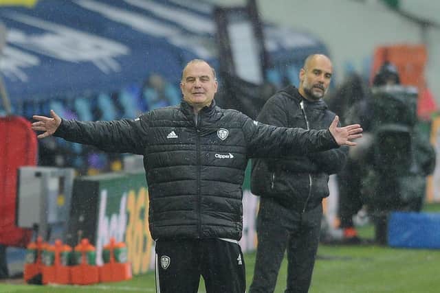SUM THAT UP! Manchester City boss Pep Guardiola looks on behind Leeds United head coach Marcelo Bielsa during Saturday evening's Premier League thriller at Elland Road. Picture by Simon Hulme.