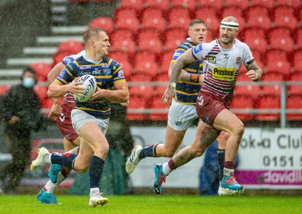 Brad Dwyer is chased by Zak Hardaker.
 Picture: Bruce Rollinson.