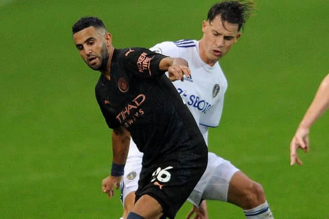 Robin Koch challenges Manchester City's Riyad Mahrez. Picture: Simon Hulme.
