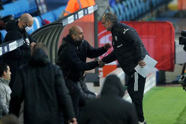 Marcelo Bielsa and Pep Guardiola shake hands on the touchline. Picture: Simon Hulme.