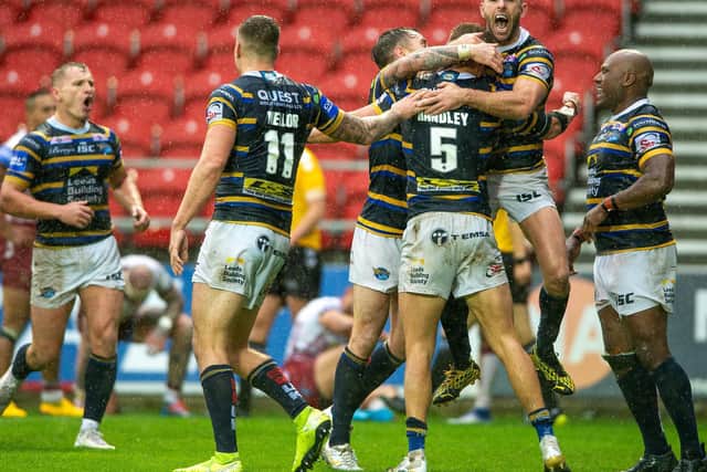Rhinos celebrate their semi-final defeat of Wigan. Picture by Bruce Rollinson.