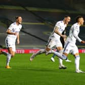 OFF THE MARK: Leeds United's record signing Rodrigo races off to celebrate after putting the Whites all square against Manchester City. Photo by Catherine Ivill/Getty Images.