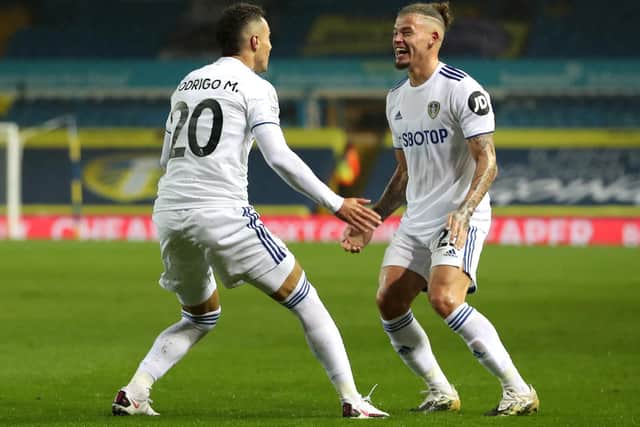 BACK ON TERMS: Kalvin Phillips, right, celebrates with Whites goalscorer Rodrigo after Leeds United draw level with Manchester City. Photo by Catherine Ivill/Getty Images.