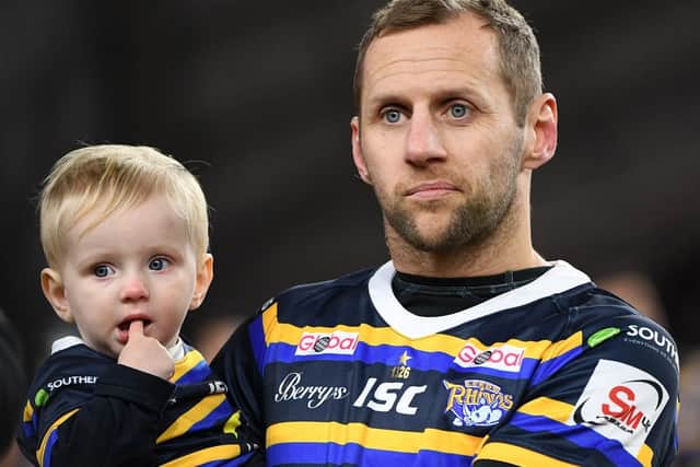 Rob Burrow with son Jackson. Picture by Jonathan Gawthorpe.