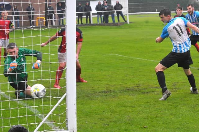 Andy Payne, right heads home the third goal for Carlton to seal the 3-1 win against league leaders Horbury Town. Picture: Steve Riding.