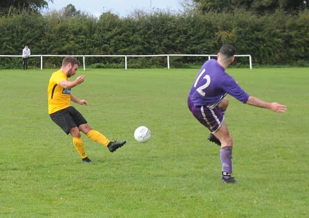 Matty Johnson scores the 12th goal for North Leodis beating Amaranth in Division 4 of the Leeds Combination League. Pictures: Steve Riding.