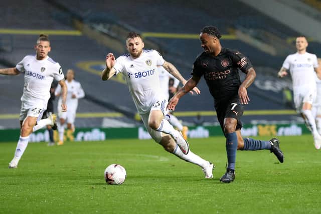 LOVING IT: Leeds United's Stuart Dallas, centre, chases down Raheem Sterling during Saturday evening's thrilling 1-1 draw against Manchester City at Elland Road. Photo by Catherine Ivill/Getty Images.