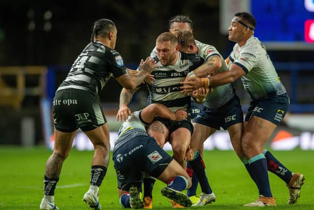 Nowhere to go: Josh Griffin is swamped by the Rhinos defence. Picture: Bruce Rollinson