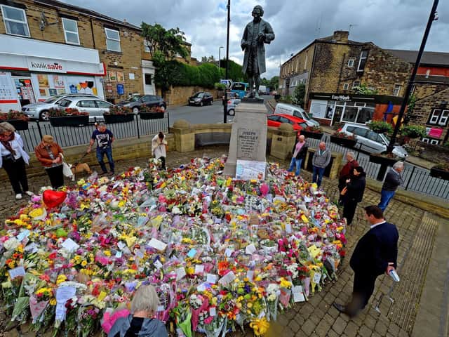 Flowers left at the scene near to where Jo Cox was killed while attending a constituents surgery in June, 2016