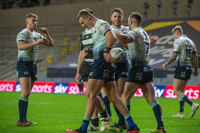 Liam Sutcliffe is congratulated after scoring against Hull FC.  Picture: Bruce Rollinson.