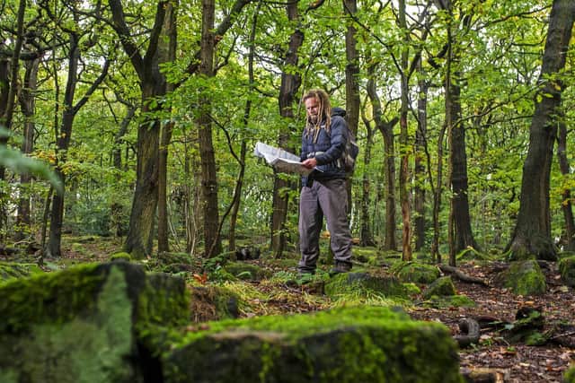 Chris Goddard exploring woodland in the Aire Valley. Picture: Tony Johnson.