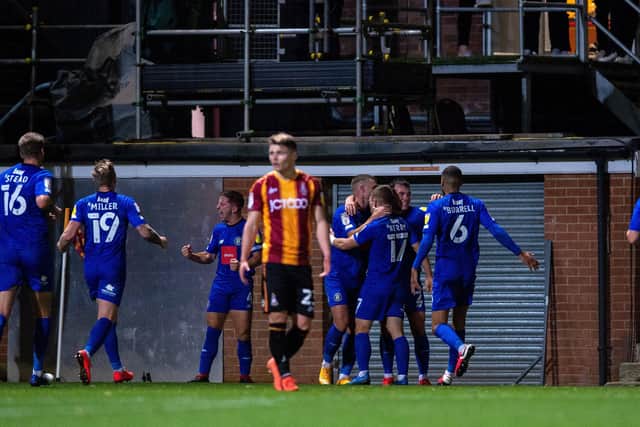 MATCH-WINNER: Lloyd Kerry (No 17) celebrates his goal for Harrogate against Bradford City at Valley Parade.  Picture: Bruce Rollinson