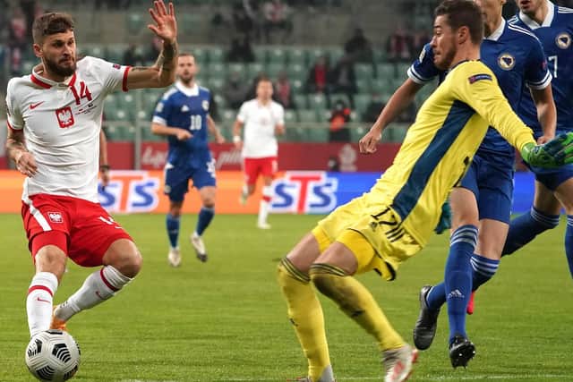 FINE ASSIST: From Leeds United's Polish international midfielder Mateusz Klich, left, pictured during his side's 3-0 win at home to Bosnia and Herzegovina. Photo by JANEK SKARZYNSKI/AFP via Getty Images.