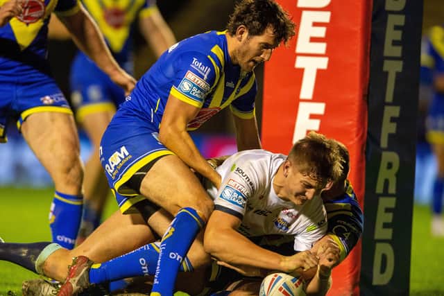 Sam Walters touches down against 
Warrington Wolves. Picture: Bruce Rollinson.
