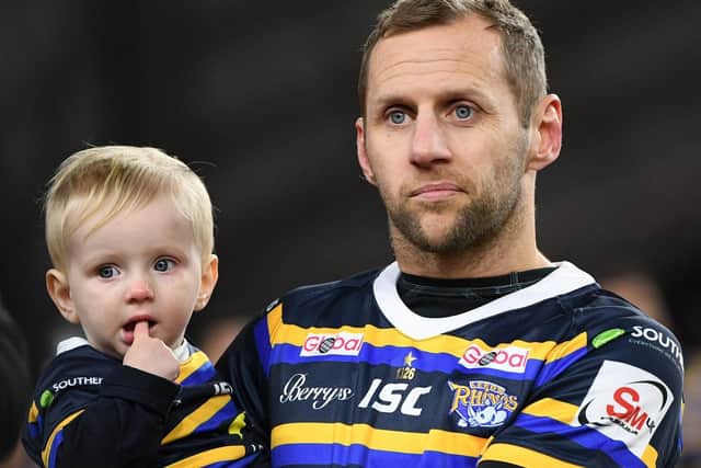 Rob Burrow with his son Jackson. Picture by Jonathan Gawthorpe.